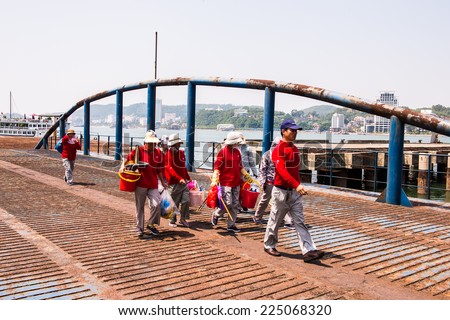 HA LONG CITY, VIETNAM - SEP 23, 2014: Unidentified people at the port of the Halong city where many touristic boat start jorneys over the Halong bay which is UNESCO World heritage