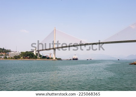 HA LONG CITY, VIETNAM - SEP 23, 2014: Bridge of the Halong city where many touristic boat start jorneys over the Halong bay which is UNESCO World heritage