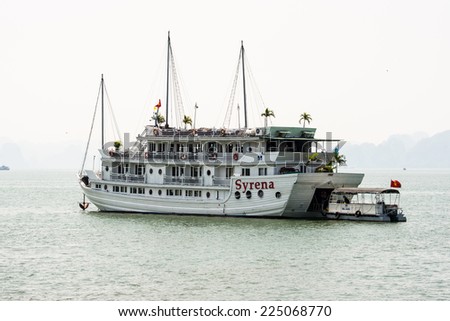 HA LONG CITY, VIETNAM - SEP 23, 2014: Boat near the port of the Halong city where many touristic boat start jorneys over the Halong bay which is UNESCO World heritage