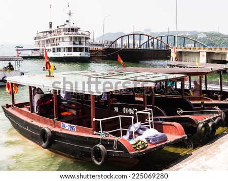 HA LONG CITY, VIETNAM - SEP 23, 2014: Passenger boat at the port of the Halong city where many touristic boat start jorneys over the Halong bay which is UNESCO World heritage