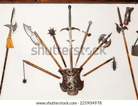 BRAN, ROMANIA - OCTOBER 27, 2013:  Arms on the wall in the Dracula Castle in Bran, Romania, on October 27, 2013.  It is marketed as the home of the Vampire Dracula, the Bram Stoker\'s novel character.