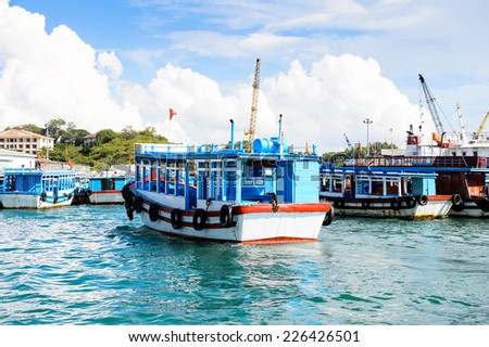 NHA TRANG, VIETNAM - SEP 30, 2014: Boats at the port of Nha Trang on the South China Sea, Vietnam. South China Sea is 3,500,000 square kilometres