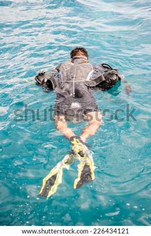 NHA TRANG, VIETNAM - SEP 30, 2014: Unidentified man is doing scuba diving in the South China Sea. South China Sea is 3,500,000 square kilometres