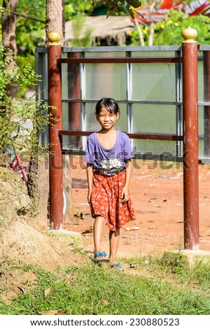SIEM RIEP, CAMBODIA - SEP 28, 2014: Unidentified Khmer little girl walks in a traditional clothes in Siem Reap. 90% of Cambodian people belong to Khmer etnic group
