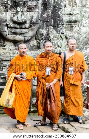 ANGKOR THOM, CAMBODIA - SEP 27, 2014: Unidentified Buddist monks from Thailand at one of the temple of Angkor Thom. Angkor Thom was the last and most enduring capital city of the Khmer empire