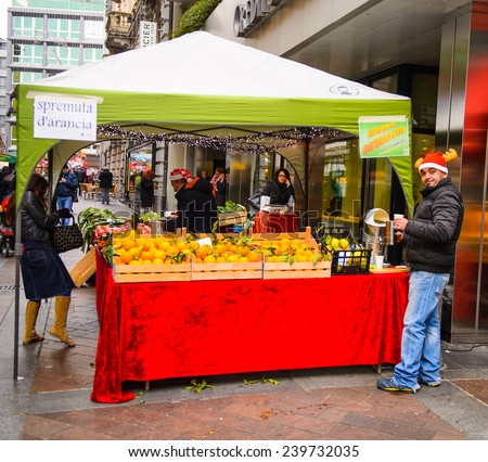 LUGANO, SWITZERLAND - DEC 24, 2014: Christmas tent on a Christmas market in the centre of Lugano. Christmas markets   started from the Late Middle Ages in  Germany, Austria
