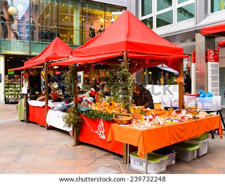 LUGANO, SWITZERLAND - DEC 24, 2014: Christmas tent on a Christmas market in the centre of Lugano. These Christmas markets   started from the Late Middle Ages in  Germany, Austria