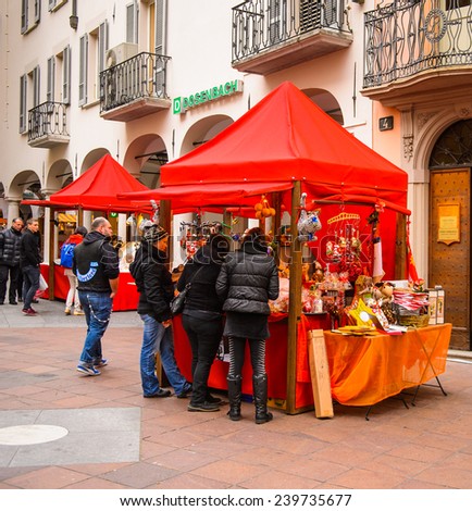 LUGANO, SWITZERLAND - DEC 24, 2014: Christmas tent on a Christmas market in the centre of Lugano. Christmas markets   started from the Late Middle Ages in  Germany, Austria