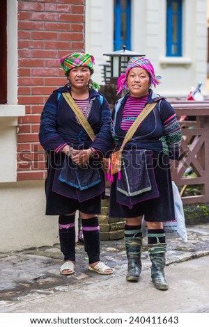 SAPA, VIETNAM - SEP 20, 2014: Unidentified Hmong woman in a traditional costume. Hmong people is a minority ethnic group living in Sapa