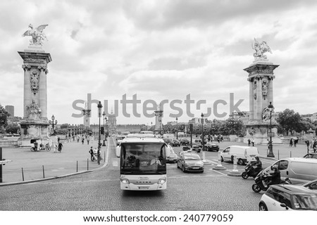 PARIS, FRANCE - JUN 17, 2014: Bridge of Alexandre III in Paris, France. This bridge connects the Champs-Elysees quarter and the Invalides and Eiffel Tower quarter.