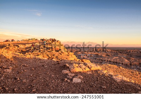 ATACAMA DESERT, CHILE - NOV 3, 2014: Unidentified tourists in the Atacama desert, Chile. Atacama Desert proper occupies 105,000 square kilometres