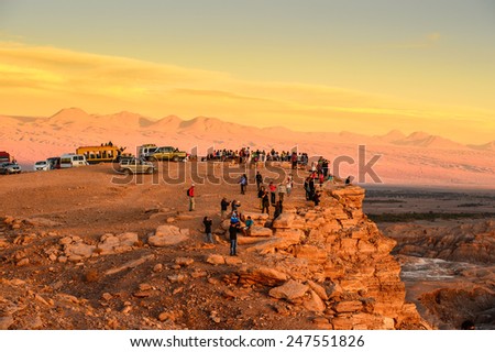 ATACAMA DESERT, CHILE - NOV 3, 2014: Unidentified tourists make pictures in the Atacama desert, Chile. Atacama Desert proper occupies 105,000 square kilometres