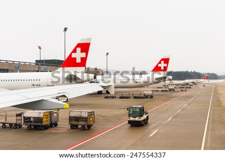 ZURICH, SWITZERLAND - JAN 26, 2015: Plane of the Swiss International Air Lines, flag carrier airline of Switzerland in the Zurich Kloten Airport, the largest international airport of Switzerland