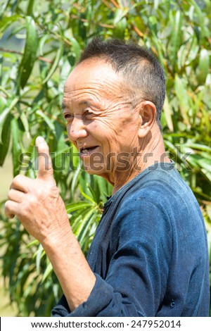 LAO CHAI VILLAGE, VIETNAM - SEP 22, 2014: Unidentified Hmong old man in Lao Chai. Hmong is on of the minority ethnic group in Vietnam