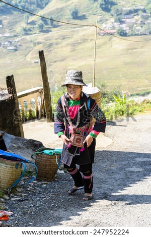 LAO CHAI VILLAGE, VIETNAM - SEP 22, 2014: Unidentified Hmong woman in traditional clothes in a village Lao Chai. Hmong is on of the minority eethnic group in Vietnam