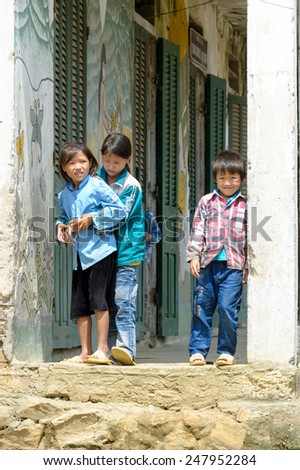 LAO CHAI VILLAGE, VIETNAM - SEP 22, 2014: Unidentified Hmong children play outside in Lao Chai. Hmong is on of the minority ethnic group in Vietnam