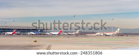 MADRID, SPAIN - JAN 26, 2015: Iberia aircrafts in the Terminal T4 of the Adolfo Suarez Madrid Barajas Airport. Barajas  is the main international airport serving Madrid in Spain.