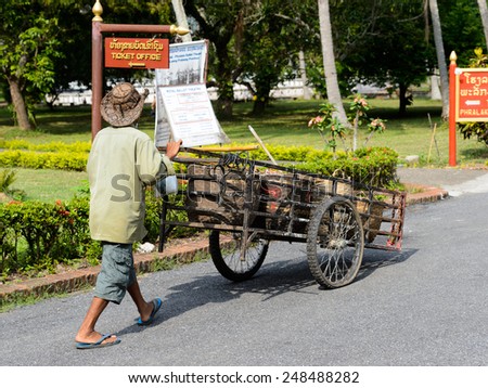 LUANG PRABANG, LAOS - SEP 25, 2014: Unidentified Lao old man in a hat. 55% of Laos people belong to the Lao ethnic group