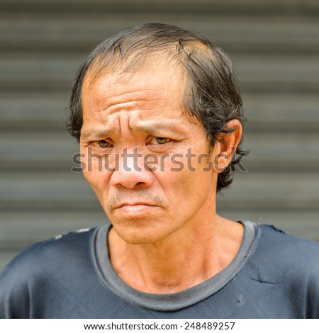 LUANG PRABANG, LAOS - SEP 25, 2014: Unidentified Lao man portrait. 55% of Laos people belong to the Lao ethnic group