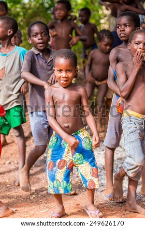 KARA, TOGO - MAR 9, 2013: Unidentified Togolese children dance and play during a local dance show. People in Togo suffer of poverty due to the unstable econimic situation