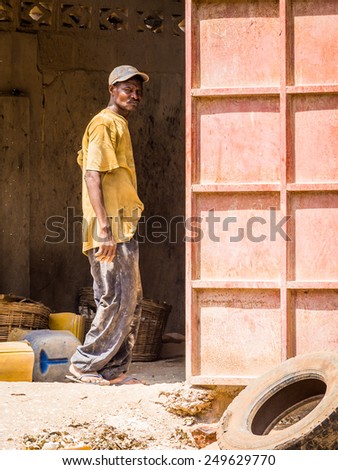 KARA, TOGO - MAR 9, 2013: Unidentified Togolese man in old dirty clothes. People in Togo suffer of poverty due to the unstable econimic situation