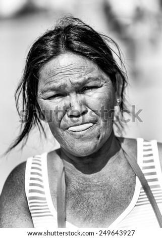 SAN JOSE, COSTA RICA - JAN 6, 2012: Unidentified Costa Rican woman tries to smile. 65.8% of Costa Rican people belong to the White (Castizo) ethnic group