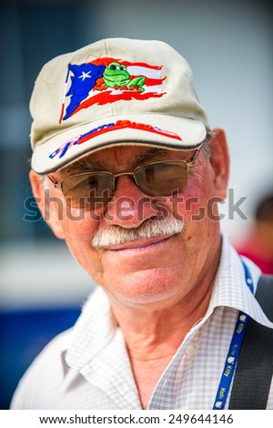 SAN JOSE, COSTA RICA - JAN 6, 2012: Unidentified Costa Rican smiling man with white mustache. 65.8% of Costa Rican people belong to the White (Castizo) ethnic group