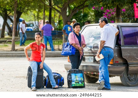 SAN JOSE, COSTA RICA - JAN 6, 2012: Unidentified Costa Rican family near the car. 65.8% of Costa Rican people belong to the White (Castizo) ethnic group