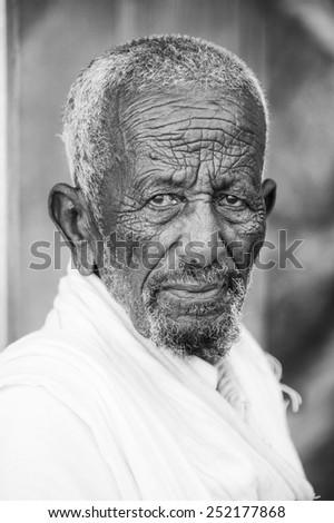 AKSUM, ETHIOPIA - SEP 24, 2011: Unidentified Ethiopian man with white beard in Ethiopia, Sep.24, 2011. Children in Ethiopia suffer of poverty due to the unstable situation