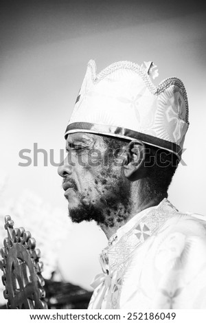LALIBELA, ETHIOPIA - SEP 27, 2011:  Unidentified Ethiopian religious man pronounces a speech during the Meskel festival in Ehtiopia, Sep 27, 2011. Meskel commemorates the finding of the True Cross
