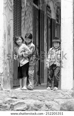 LAO CHAI VILLAGE, VIETNAM - SEP 22, 2014: Unidentified Hmong children play outside in Lao Chai. Hmong is on of the minority eethnic group in Vietnam