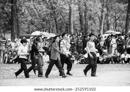 NORTH KOREA - MAY 1, 2012: Korean people participate in the public games due to the celebration of the Internationa Worker\'s Day in N.Korea, May 1, 2012. May 1 is a national holiday in 80 countries