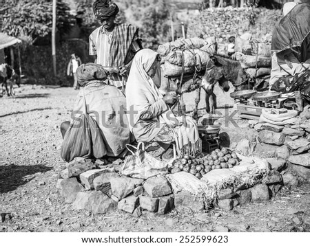 OMO, ETHIOPIA - SEPTEMBER 21, 2011: Unidentified Ethiopian women sell onions at the market. People in Ethiopia suffer of poverty due to the unstable situation