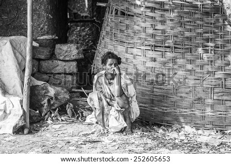 OMO, ETHIOPIA - SEPTEMBER 19, 2011: Unidentified Ethiopian woman thinks of something. People in Ethiopia suffer of poverty due to the unstable situation