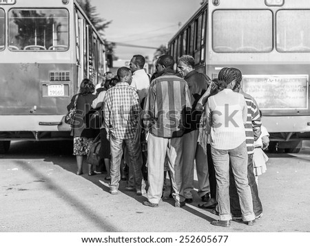 OMO, ETHIOPIA - SEPTEMBER 21, 2011: Unidentified Ethiopian people at the bus stop. People in Ethiopia suffer of poverty due to the unstable situation