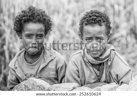 OMO, ETHIOPIA - SEPTEMBER 21, 2011: Unidentified Ethiopian boys in the street. People in Ethiopia suffer of poverty due to the unstable situation