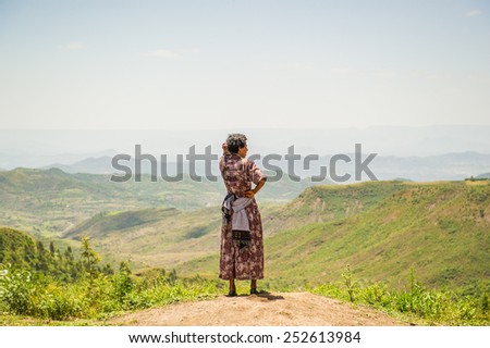OMO, ETHIOPIA - SEPTEMBER 21, 2011: Unidentified Ethiopian woman from behind. People in Ethiopia suffer of poverty due to the unstable situation