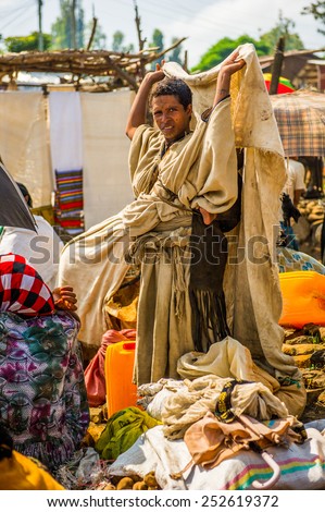 OMO, ETHIOPIA - SEPTEMBER 19, 2011: Unidentified Ethiopian woman works at the local market. People in Ethiopia suffer of poverty due to the unstable situation