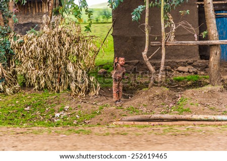 OMO, ETHIOPIA - SEPTEMBER 21, 2011: Unidentified Ethiopian boy says hello. People in Ethiopia suffer of poverty due to the unstable situation