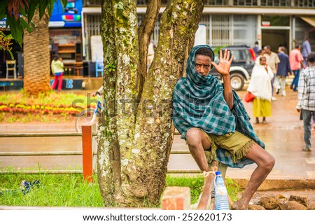 OMO, ETHIOPIA - SEPTEMBER 20, 2011: Unidentified Ethiopian man says hello. People in Ethiopia suffer of poverty due to the unstable situation