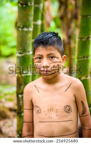 YASUNI, ECUADOR - JAN 4, 2015:  Unidentified Ecuadorian indian little boy. Indigenous indians  are protected by COICA (Coordinator of Indigenous Organizations of the Amazon River Basin)