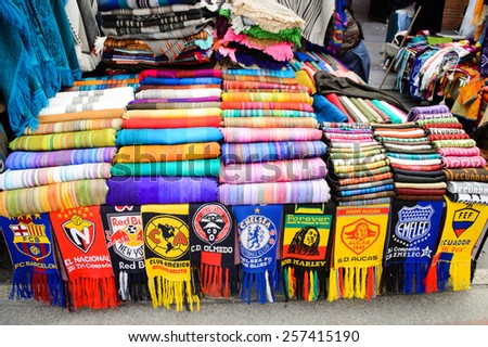 OTAVALO, ECUADOR - JAN 7, 2015: Colorful Souvenirs of the Otavalo market  designed and built in 1970 by Dutch architect Tonny Zwollo
