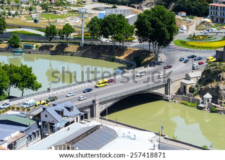 TBILISI, GEORGIA - JULY 18, 2014: Bridge over the river of Tbilisi, Georgia. Tbilisi is the capital and the largest city of Geogia with 1,5 mln people population