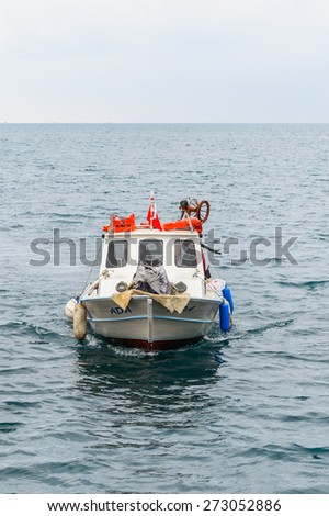 ANTALYA, TURKEY - APR 19, 2015: Boat on the Mediterranean sea near the Old harbour in Antalya (Kaleici), Turkey.  Mediterranean sea is 2,500,000 km2