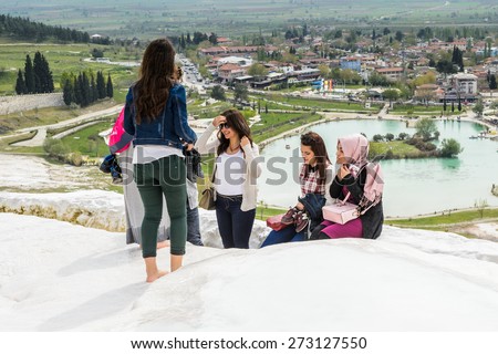PAMUKKALE, TURKEY - APR 18, 2015: Unidentified tourists on the travertines of Pamukkale, Turkey. It\'s a UNESCO World Heritage site