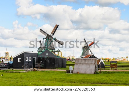 ZAANSE SCHANS, NETHERLANDS - MAY 2, 2015: Nature and windmills in Zaanse Schans, Northe Holland, Netherlands. This village is a popular touristic destination in Netherlands