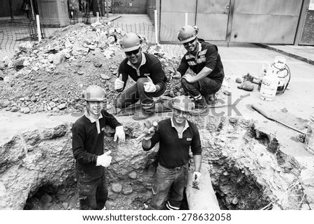 SANTIAGO, CHILE - NOV 1, 2014:  Unidentified Chilean constructor during their work. Chilean people are mainly of mixed Spanish and Amerindian descent
