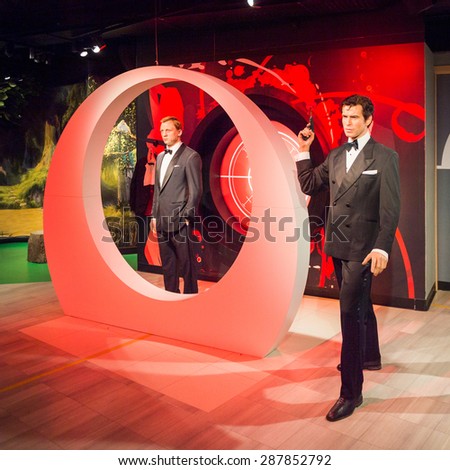 AMSTERDAM, NETHERLANDS - JUN 1, 2015: Daniel Craig and Pierce Brosnan as the agent 007 James Bond in Madame Tussauds museum in Amsterdam. Marie Tussaud was born as Marie Grosholtz in 1761