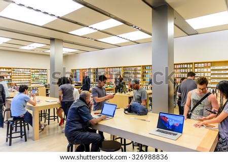 SAN FRANCISCO, USA - OCT 5, 2015: Unidentified clients in the Apple store in San Francisco. Apple Inc. is an American multinational technology company in Cupertino, California