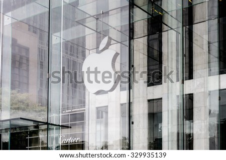 NEW YORK, USA - SEP 22, 2015: Apple brand on the Apple store on the Fifth Avenue, New York. The store sells Macintosh personal computers, software, iPod, iPad, iPhone, Apple Watch, Apple TV